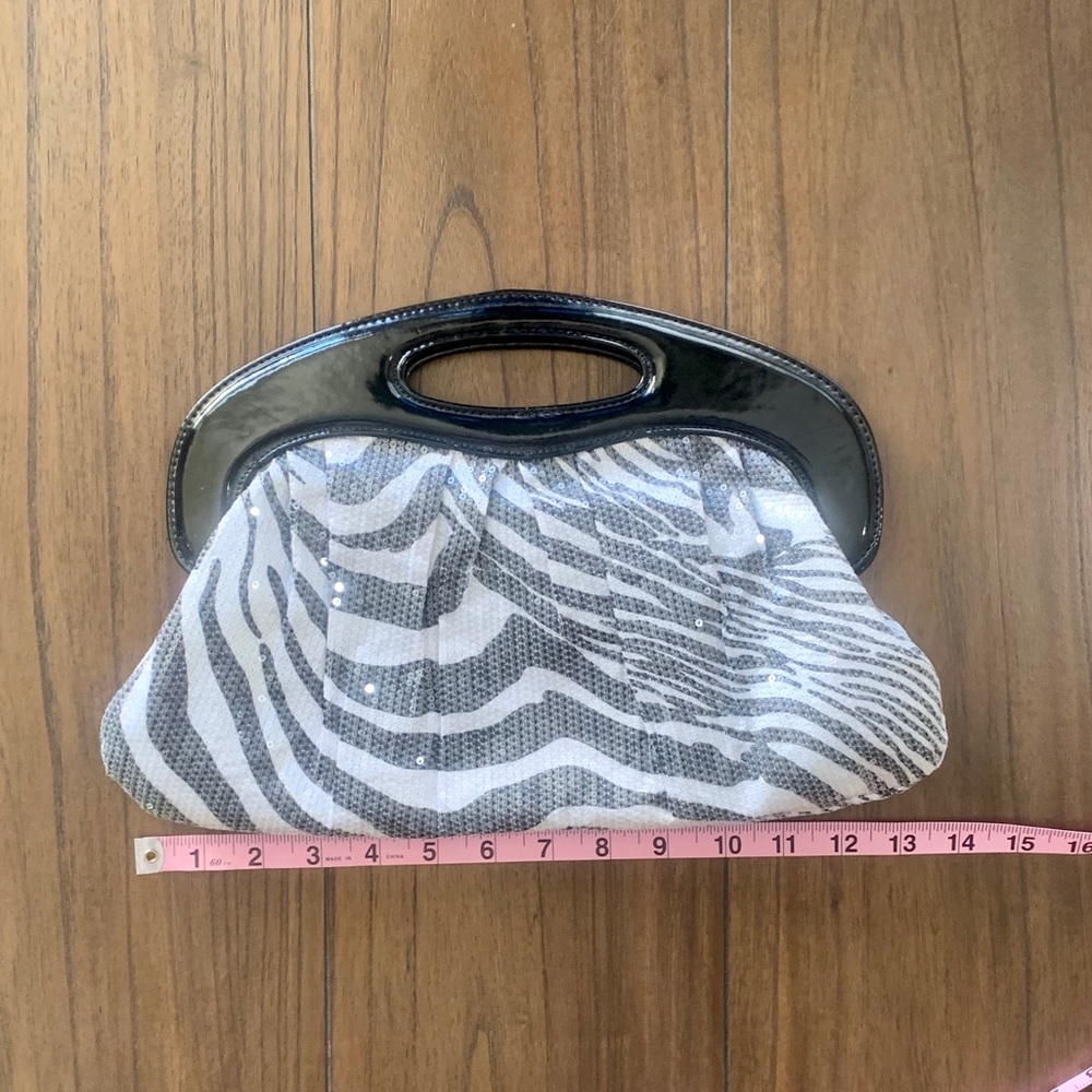 Express zebra print magnetic clasp hand bag